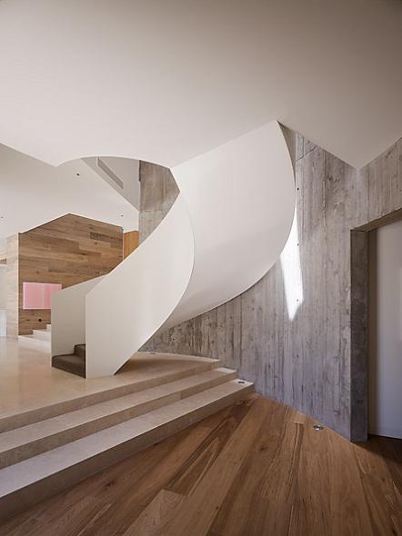 a spiral staircase The Yarra House: Interior Design Inspiration