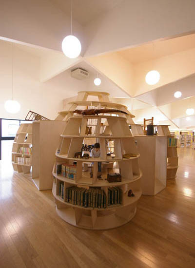 enclosed bookshelf area space with seating and tables built in Yamakoya: The Japanese Bookshelf Cabin