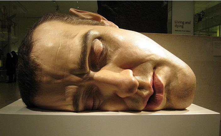 ron mueck face on side self portrait hyperrealistic Ever Seen a Sculpture with a Gigantic Head?