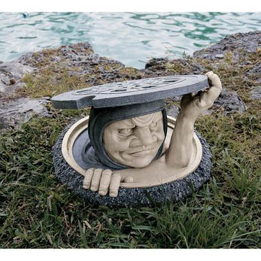 man in sewer manhole garden sculpture lawn ornament 13 Utterly Ridiculous Lawn Ornaments