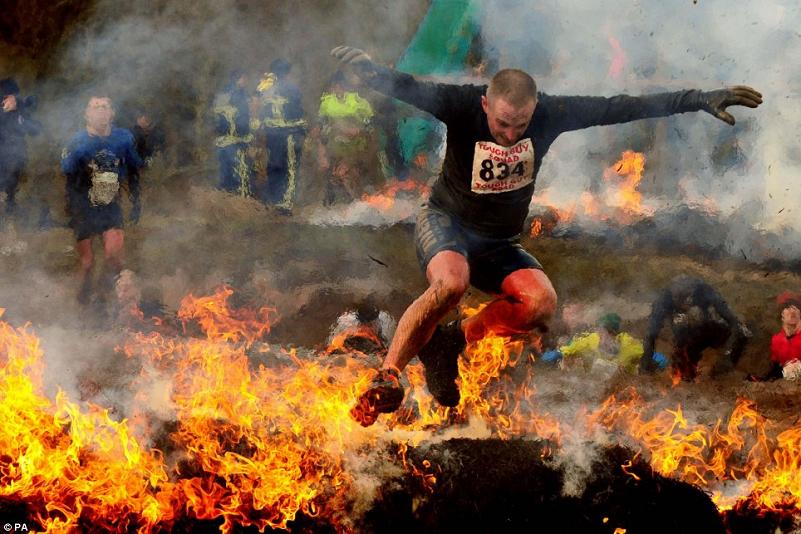 man jumping through fire tough guy contest Picture of the Day   February 2, 2010