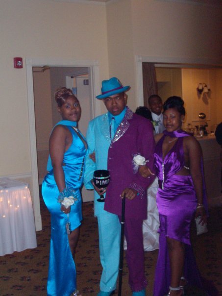 pimp with half blue half purple suit and two women and chalice The Friday Shirk Report   May 21, 2010 | Volume 58