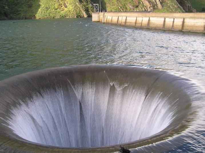 plug hole giant drain in water Bell Mouth Spillways: How Giant Holes in the Water are Possible