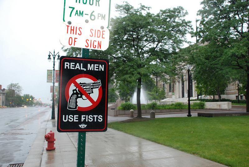 real men use fists anti gun street sign trustocorp Signs of the Times by Trusto Corp