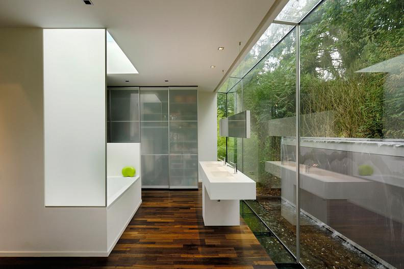 beautiful bathroom with wall to wall windows A Beautiful Bungalow Built Atop A Pond