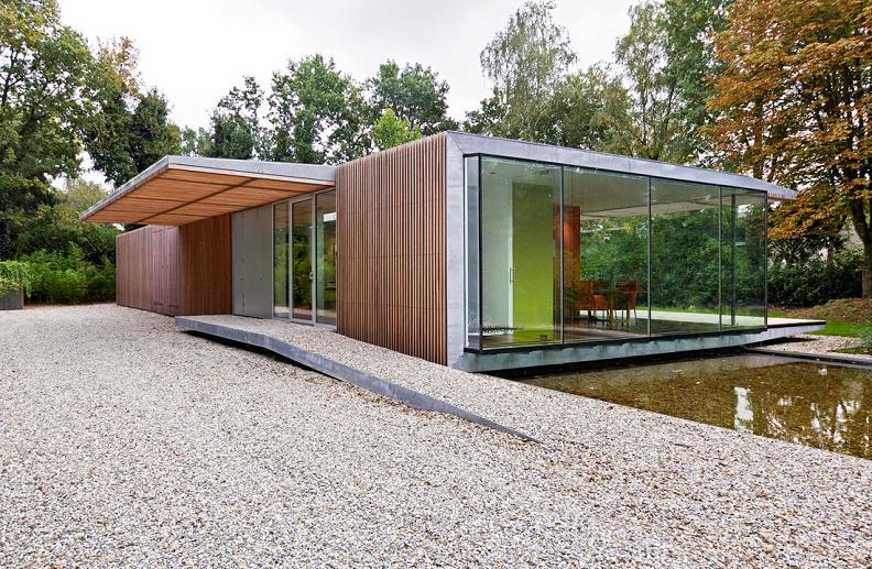 bungalow with water running underneath paul de ruiter A Beautiful Bungalow Built Atop A Pond