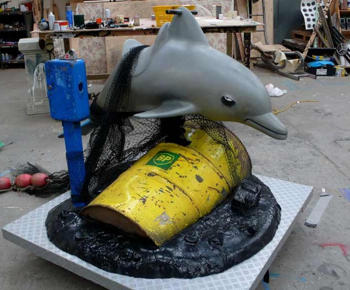 banksy dolphin ride bp oil spill drum barrel Picture of the Day   This Oil Ride is Slick