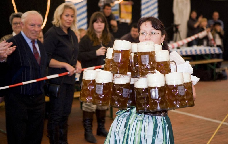 woman carrying lots of beer oktoberfest Picture of the Day   October 12, 2010