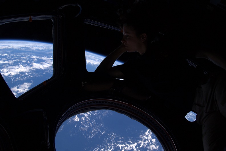 woman astronaut looking at earth from space Picture of the Day: Theres No Place Like Home | Nov 17, 2010