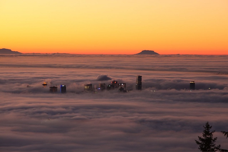 fog rolling over vancouver Picture of the Day: Fog Rolls Through Vancouver