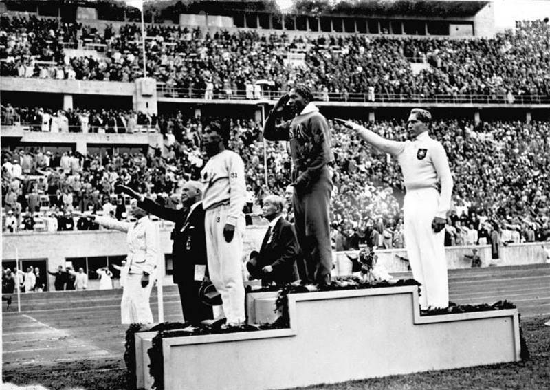 owens on podium 1936 olympics This Day In History   May 25th