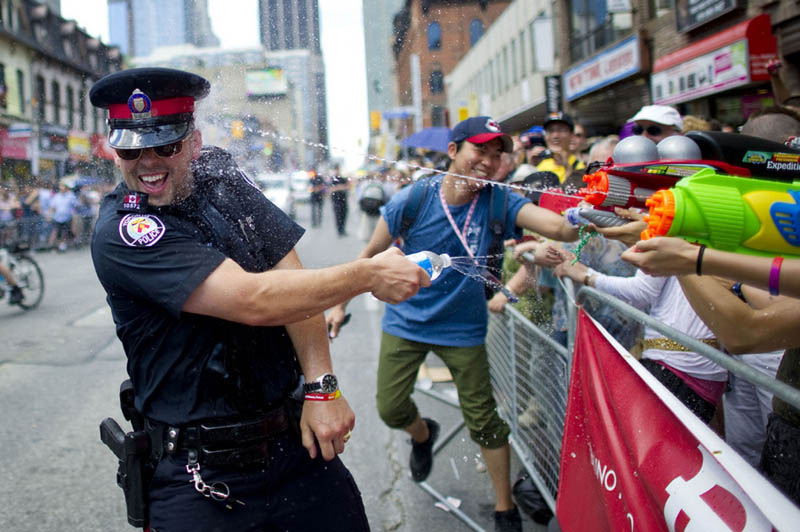 canadian toronto police officer water fight during pride 2011 carlos osorio Picture of the Day: Cops in Canada