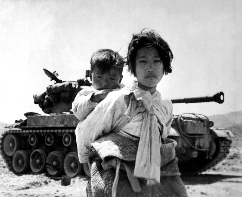 korean war children refugees in front of tank This Day In History   July 27th
