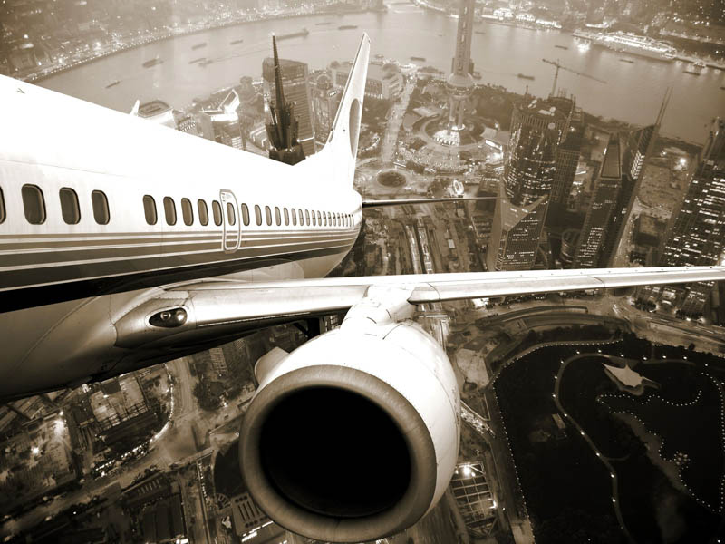 view of city behind plane taking off shanghai Picture of the Day: I want to fly away