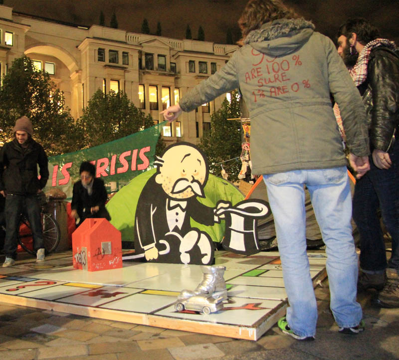 banksy occupy london lsx rich uncle frank pennybags begging Picture of the Day: Banksy Strikes Occupy London Protests