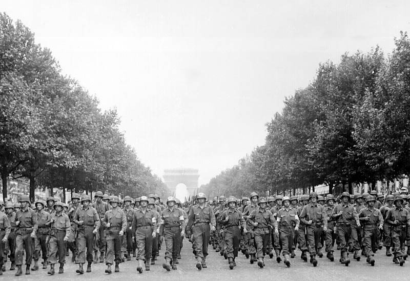 wwii liberation of paris american troops march down the champs elysees This Day In History   October 19th