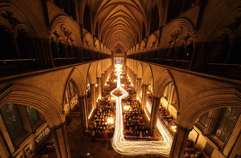 salisbury cathedral trail of candle lights long exposure Picture of the Day: Long Exposure Candle Trails at Salisbury Cathedral