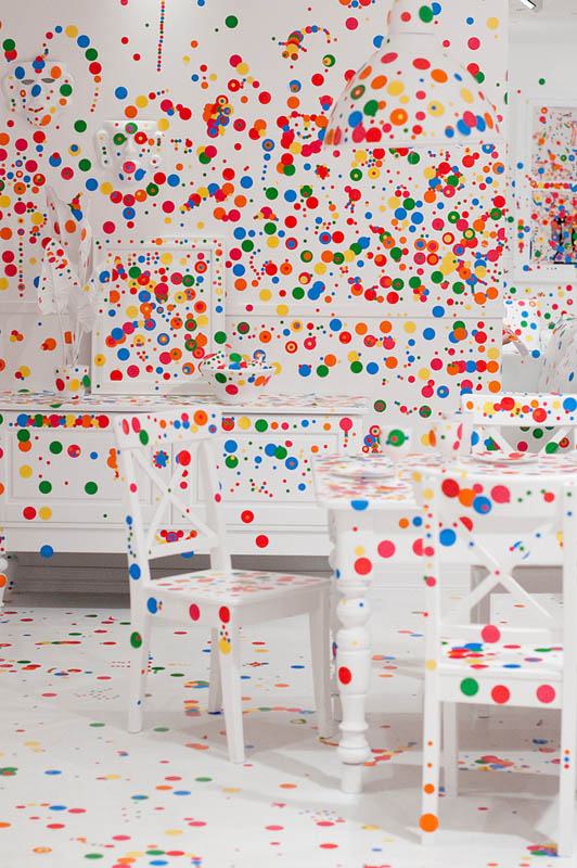 white room covered in stickers by kids yayoi kusama obliteration room 8 Kids Turn White Room into Explosion of Color