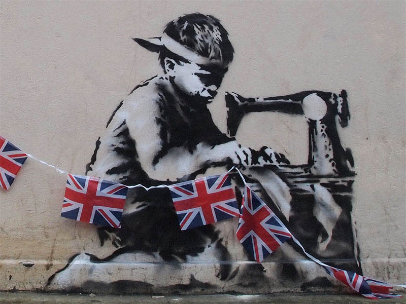 banksy boy sewing british flags street art stencil 2 10 Latest Artworks from Banksy