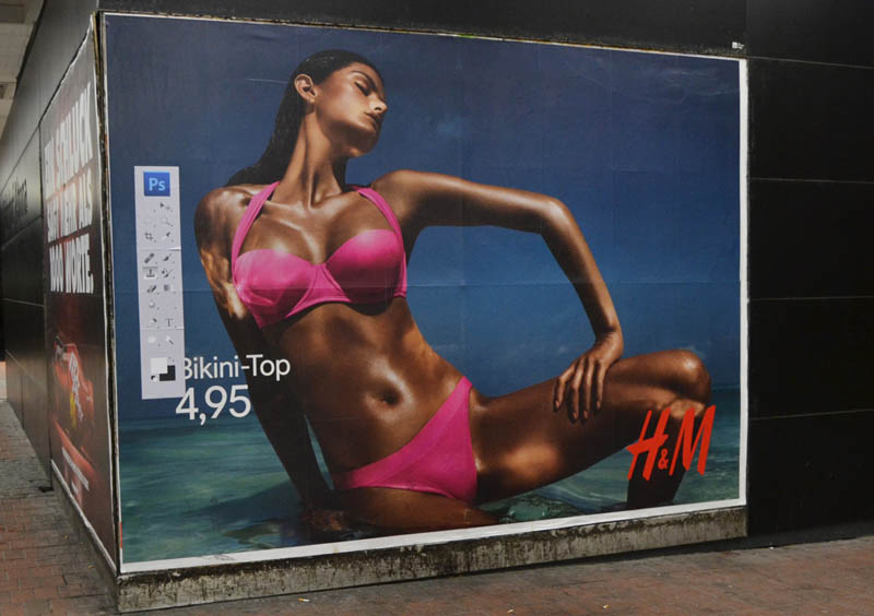 hm photoshop adbuster street art hamburg germany 2 Anonymous Street Artist Adds Photoshop Toolbar to H&M Billboards