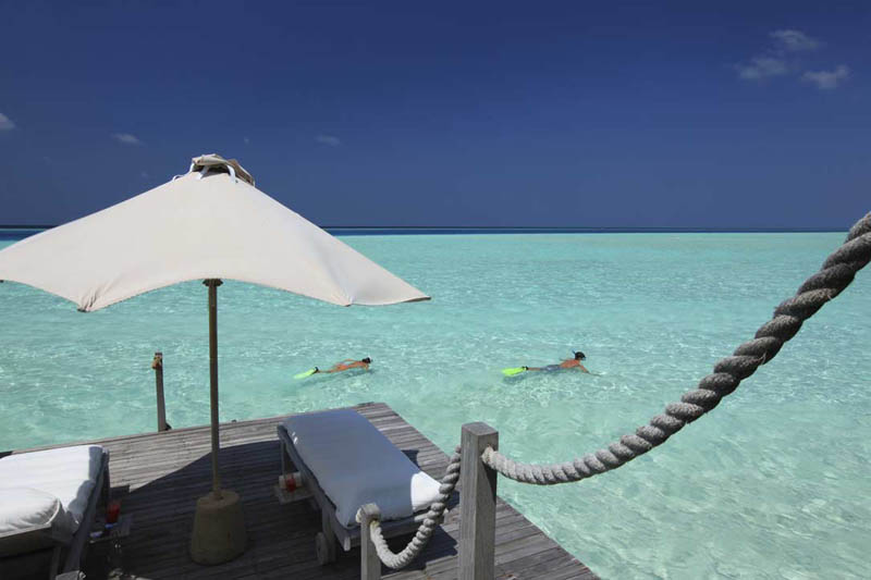 snorkeling from villa private deck copy The Amazing Stilt Houses of Soneva Gili in the Maldives