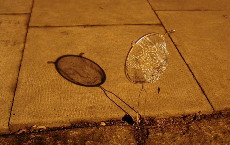 strainer shadow faces made from colanders isaac cordal 4 Faces Drawn Onto Maps by Ed Fairburn
