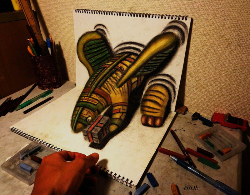 3d drawing with color pencils and two sketchbooks perpendicular. artists hand visible for reference 