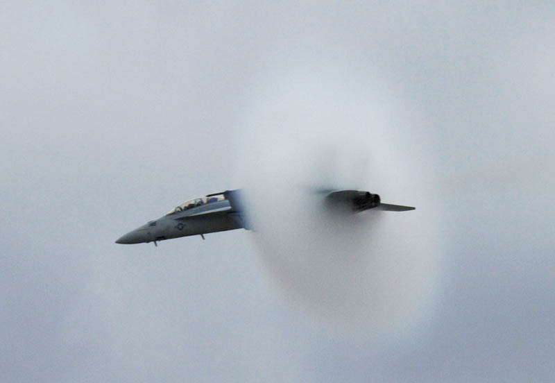 super hornet going supersonic speed from the side view