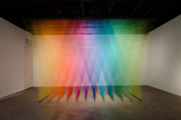 color spectrum made from different colored thread art installation