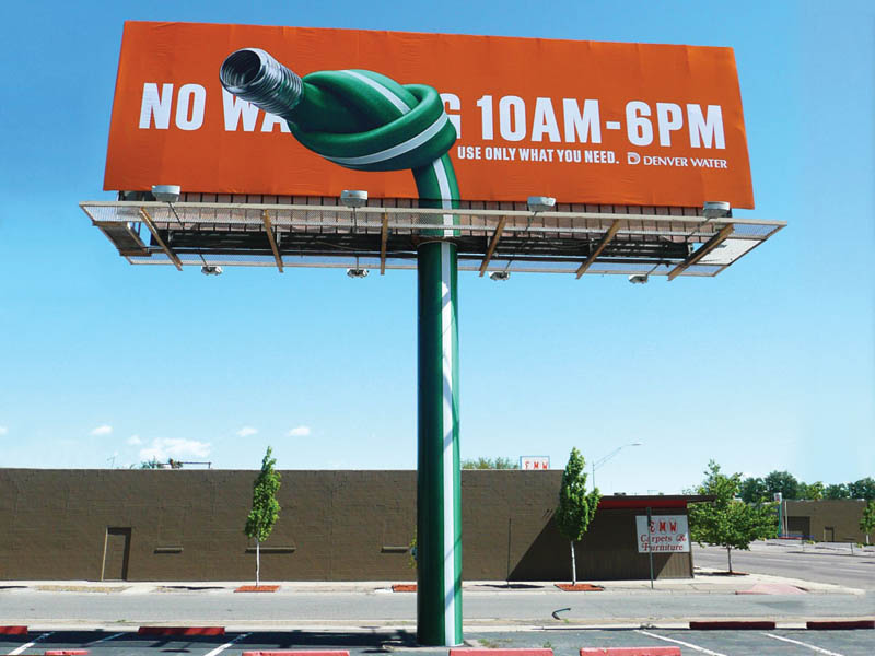 billboard showing hose knotted to conserve water