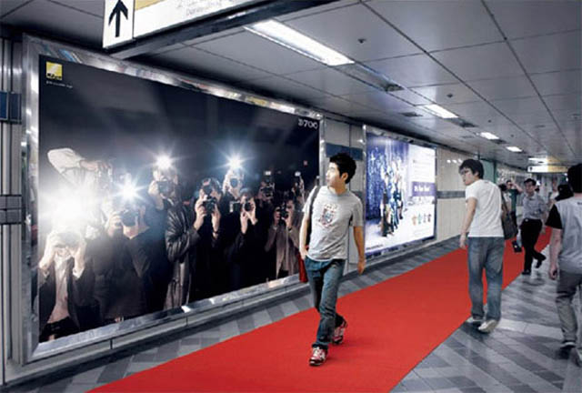 billboard of people taking pictures and flashes paparazzi