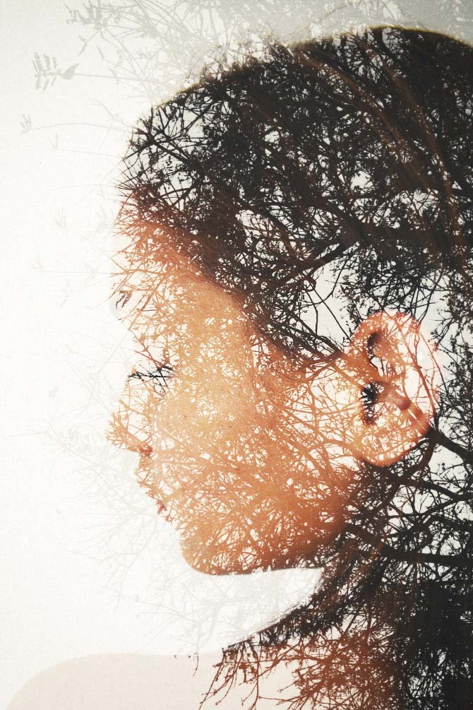 colored double exposure of woman with trees in background