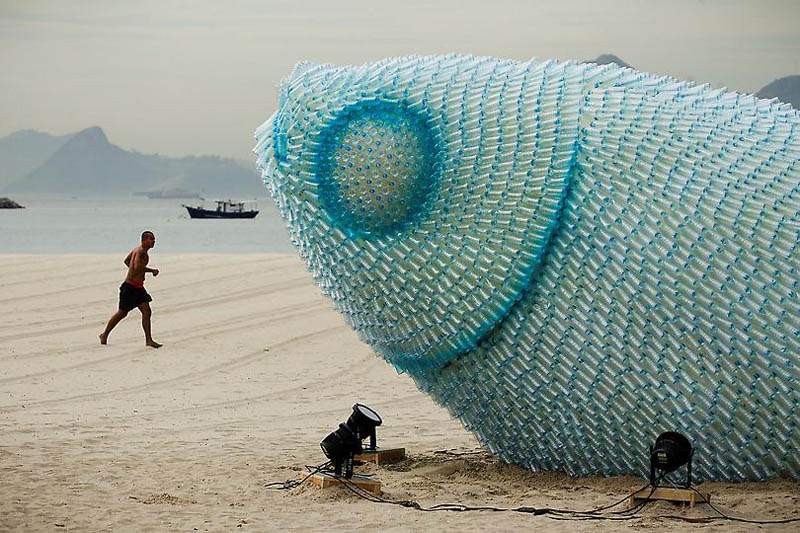closeup shows the thousands of plastic bottles used to create giant fish sculptures to raise awareness for oceans