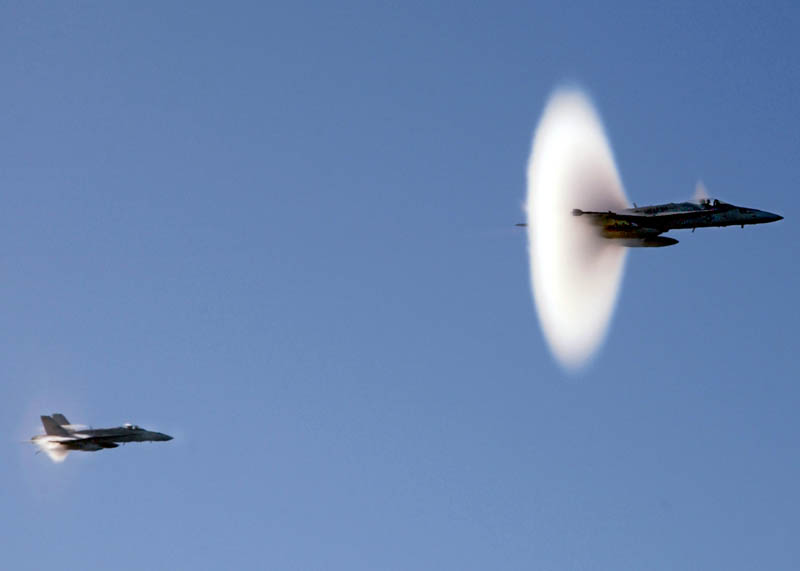 two planes breaking the sound barrier at mach 1 at the same time