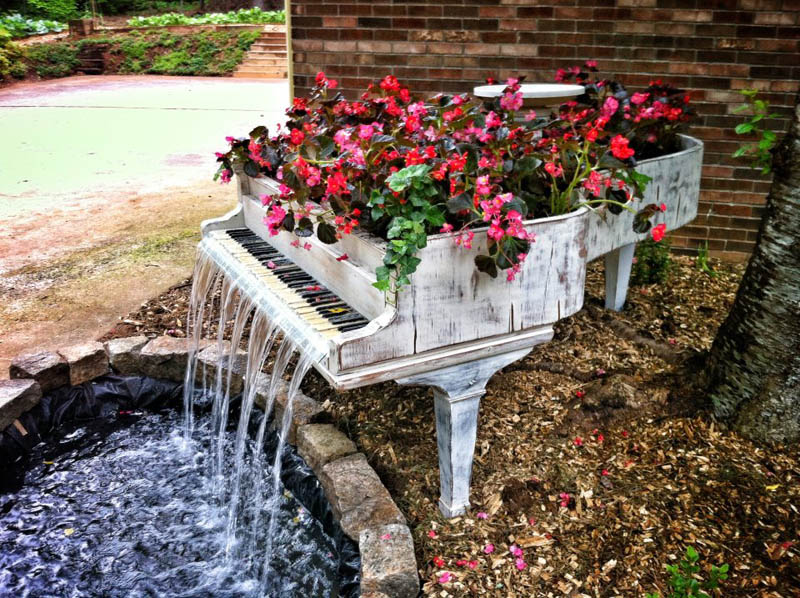 old piano turned into outdoor water fountain Mom Gives Son Lamp Filled With Items She Found Doing His Laundry Growing Up