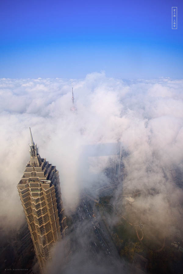 aerial view of shanghai above the clouds