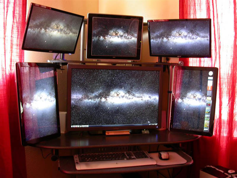 six monitors all tiled inwards computer station setup four landscape two portrait style