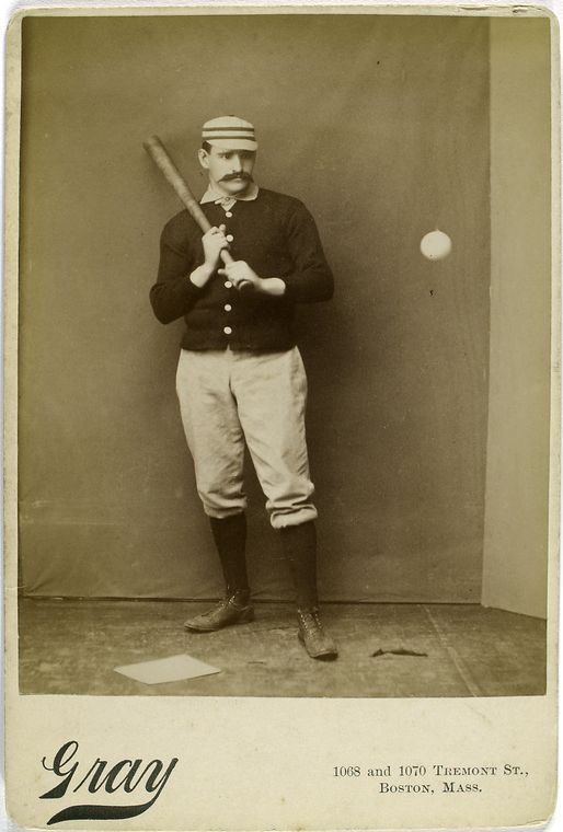 joe mulvey looking at baseball with bat in hand