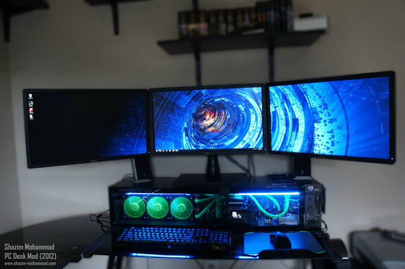 three monitor computer station set up with custom built cpu underneath