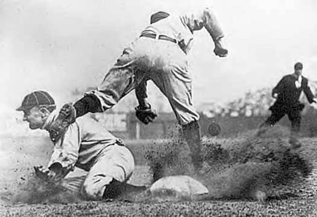cropped version of iconic photo showing ty cobb stealing third base