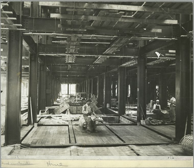 workers having lunch on one of the floors that have been built