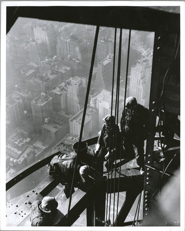 Workers on Empire State building sitting on beam unsecured