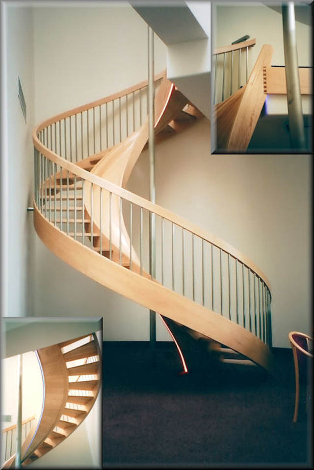 spiral wooden staircase inside a house with a built-in slide