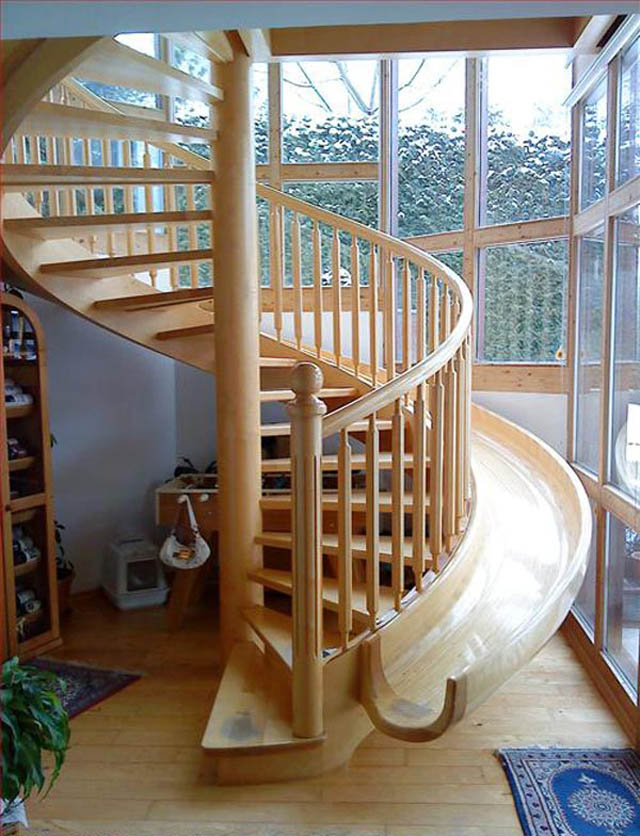 beautiful wooden spiral stairs with a slide integrated