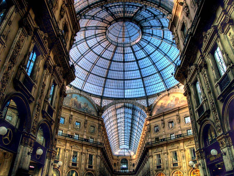 view looking up from the inside of the galleria in milan double arcade above