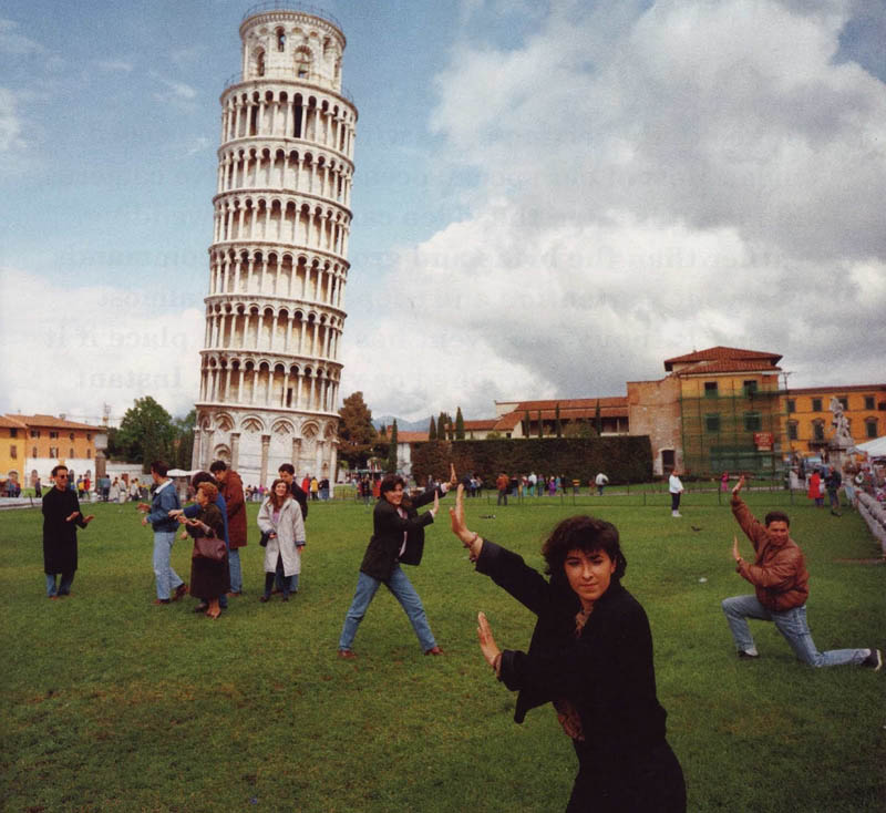 image of people pretending to lean on the tower of pisa in italy