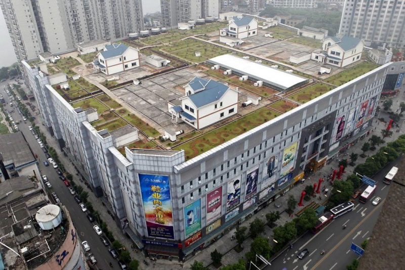 houses built on roof of shopping mall in zhuzhou china 1 Cramped Hong Kong Apartments from Above