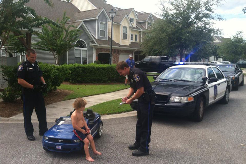kid pulled over by cops in toy mustang The Shirk Report   Volume 180