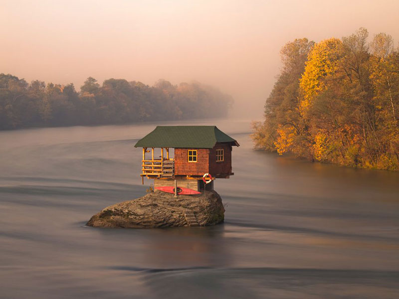 little house on rock in the middle of a river in serbia The Top 100 Pictures of the Day for 2012