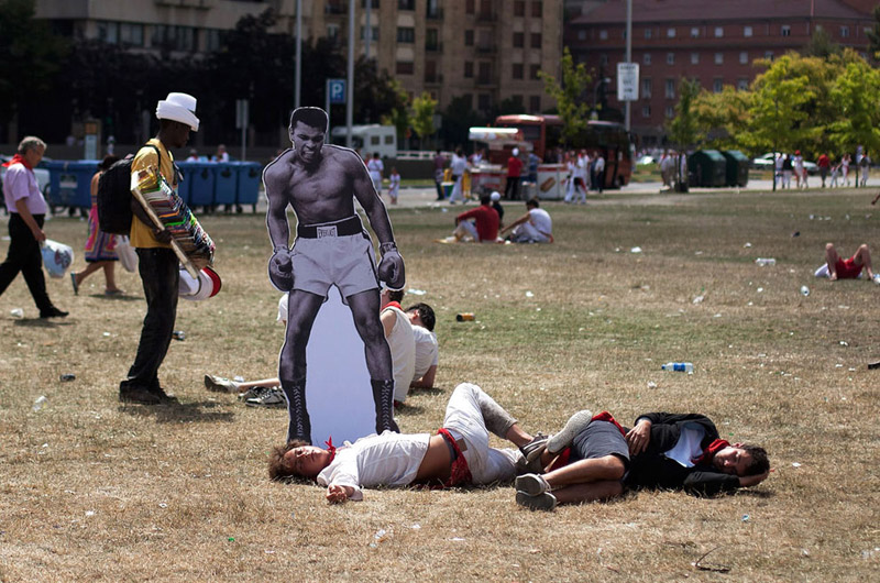 ali cutout placed beside passed out people in park The Shirk Report   Volume 191